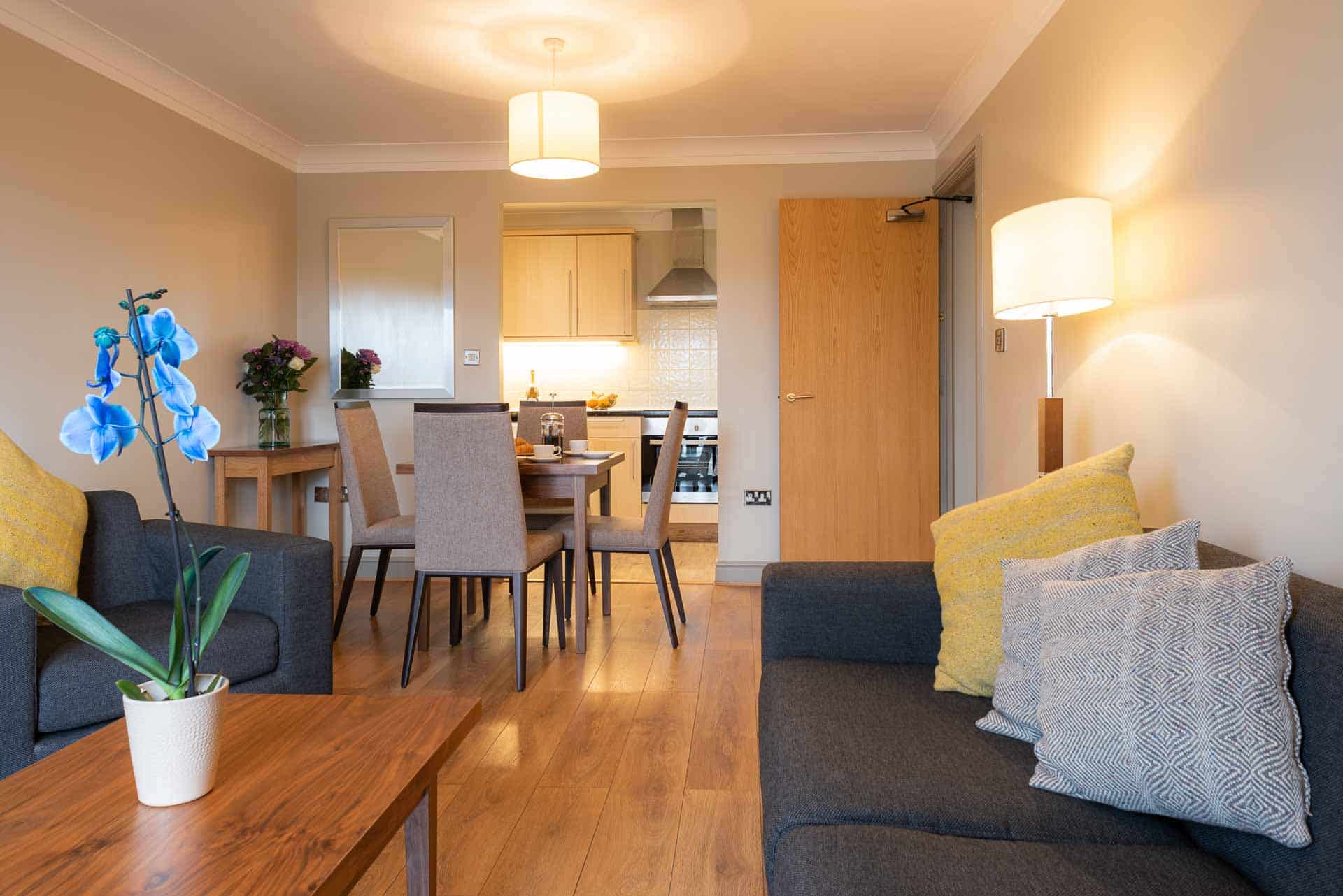 open plan living space with siting room and kitchen at premier suites bristol redcliffe 1